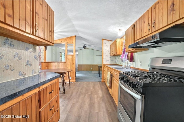 207 State Highway 5s, Florida, NY 12137 - kitchen featuring stainless steel gas range oven, a sink, under cabinet range hood, ceiling fan, and light wood finished floors
