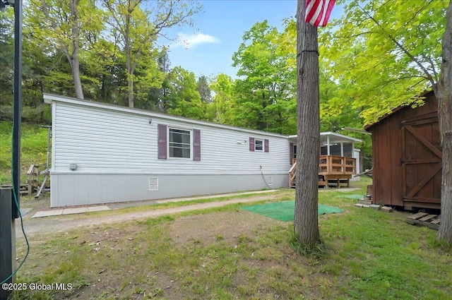 207 State Highway 5s, Florida, NY 12137 - rear view of house with a wooden deck and a lawn