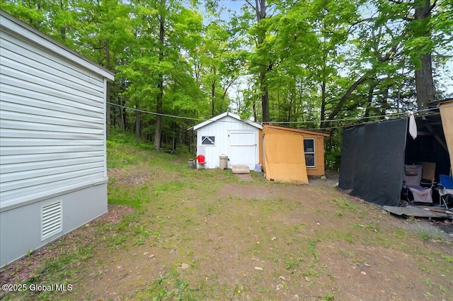 207 State Highway 5s, Florida, NY 12137 - view of yard with a storage unit, an outbuilding, and view of scattered trees