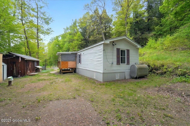 207 State Highway 5s, Florida, NY 12137 - view of property exterior featuring oil tank, an outbuilding, crawl space, and a storage unit