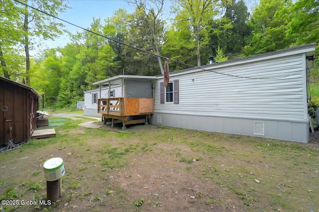 207 State Highway 5s, Florida, NY 12137 - view of property exterior featuring a wooden deck and crawl space