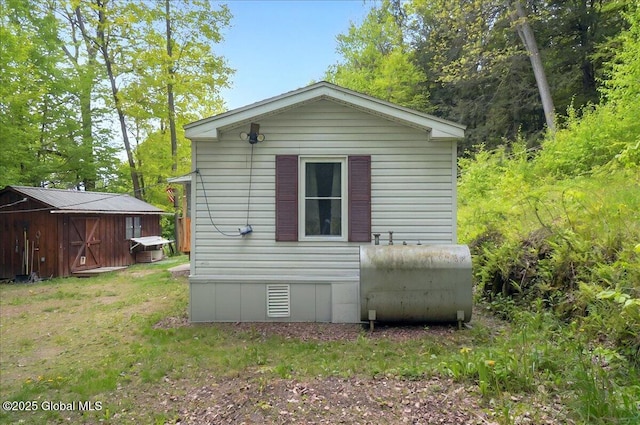 207 State Highway 5s, Florida, NY 12137 - view of property exterior featuring oil tank, an outbuilding, and a storage unit