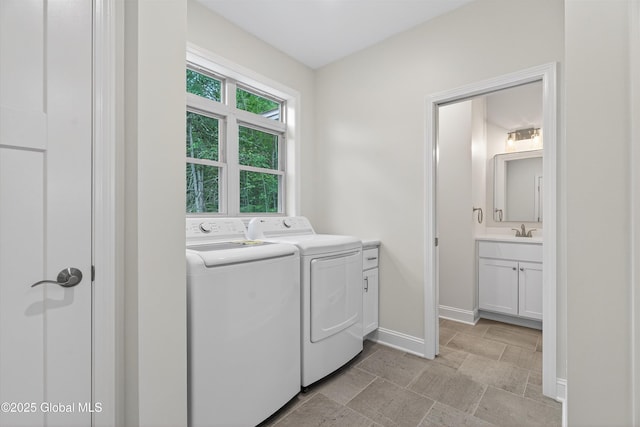 480 Selfridge Rd, Moreau, NY 12831 - washroom with cabinet space, washer and dryer, and light stone finish floors