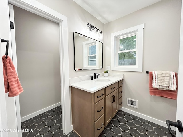 354 Mohawk Ave, Scotia, NY 12302 - bathroom featuring vanity, baseboards, and tile patterned floors