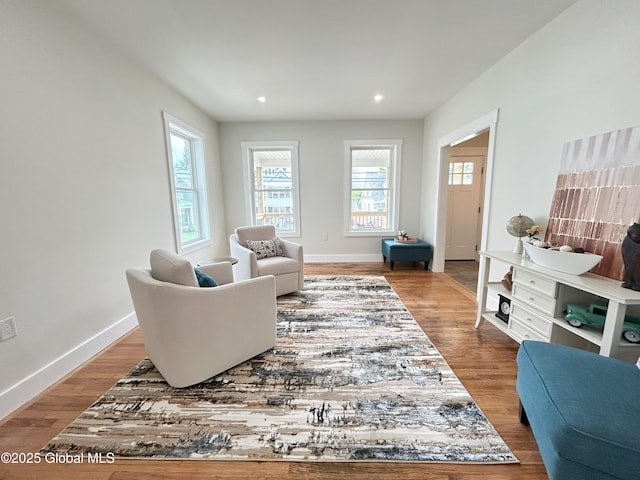 354 Mohawk Ave, Scotia, NY 12302 - living room with wood finished floors, baseboards, and recessed lighting