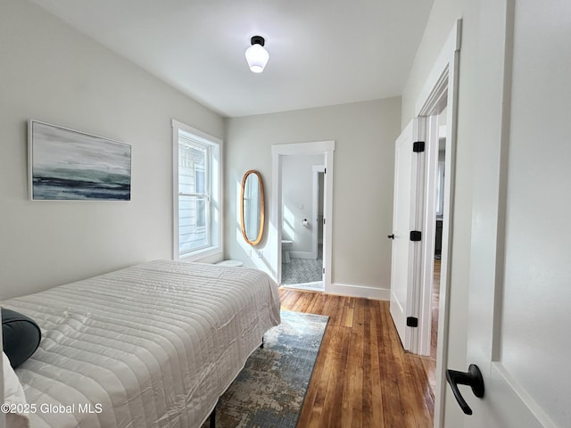 354 Mohawk Ave, Scotia, NY 12302 - bedroom with wood finished floors, baseboards, and ensuite bath