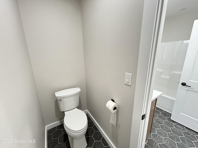 354 Mohawk Ave, Scotia, NY 12302 - bathroom with toilet, baseboards, and tile patterned floors