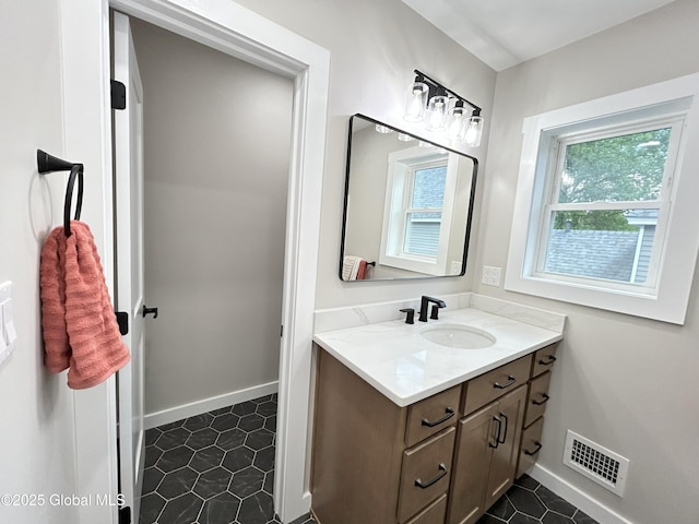 354 Mohawk Ave, Scotia, NY 12302 - bathroom featuring vanity, tile patterned floors, and baseboards