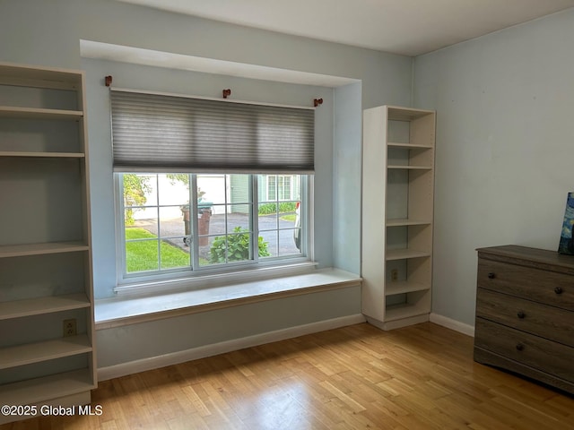 33 Oak Rd, Bethlehem, NY 12054 - unfurnished bedroom with wood finished floors and baseboards