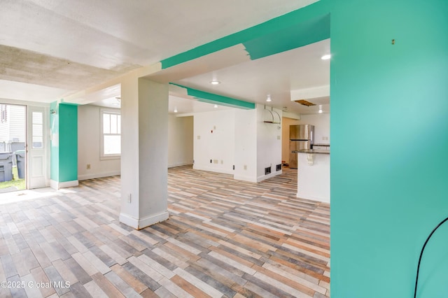 676 Stoner Trail Rd, Mohawk, NY 12068 - unfurnished living room featuring baseboards and light wood-type flooring