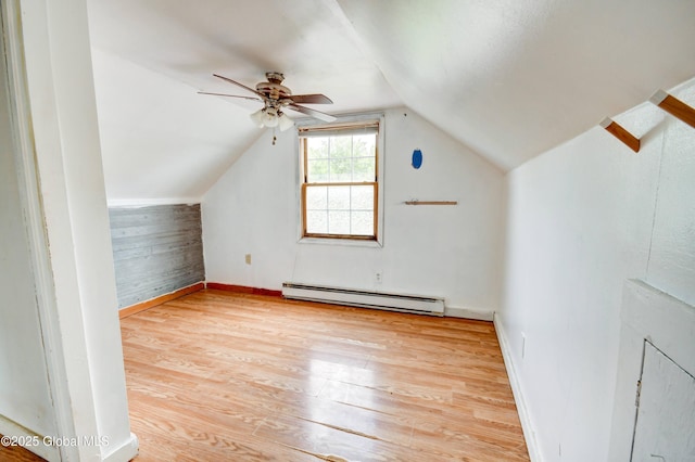 676 Stoner Trail Rd, Mohawk, NY 12068 - bonus room with a baseboard radiator, light wood finished floors, a ceiling fan, lofted ceiling, and baseboards