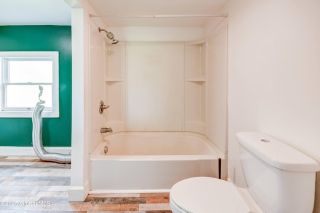 676 Stoner Trail Rd, Mohawk, NY 12068 - full bathroom with toilet, tub / shower combination, and baseboards
