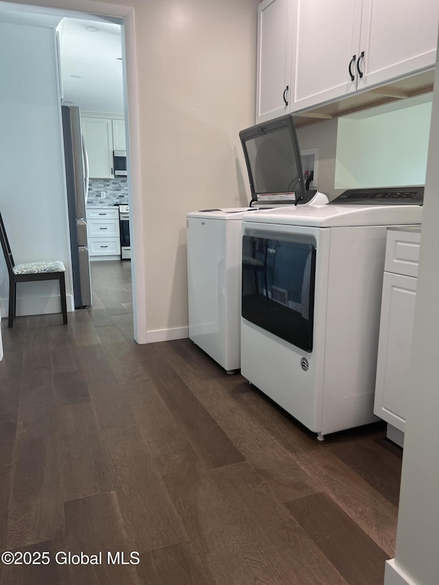 32 Old Sparrowbush Rd, Colonie, NY 12110 - laundry area with cabinet space, dark wood-style floors, baseboards, and washing machine and dryer