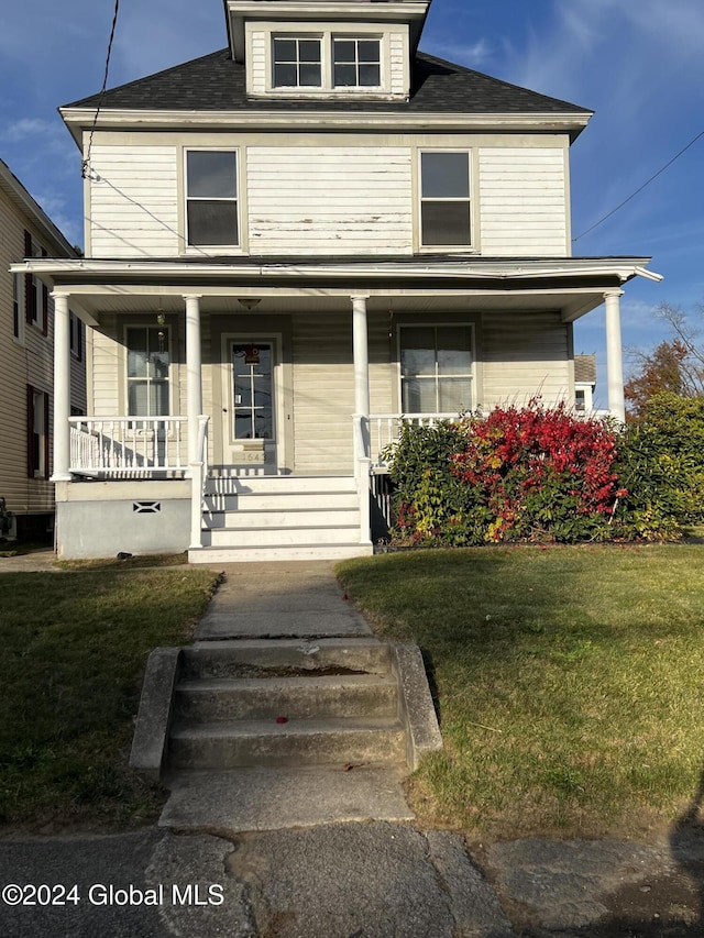 1643 Rugby Rd, Schenectady, NY 12309 - american foursquare style home with a porch, a front lawn, and roof with shingles
