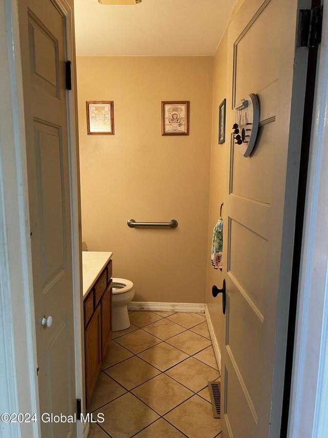 1643 Rugby Rd, Schenectady, NY 12309 - bathroom featuring vanity, tile patterned flooring, baseboards, and toilet