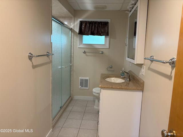 3 State Cir, Gloversville, NY 12078 - bathroom with vanity, toilet, a stall shower, tile patterned flooring, and baseboards
