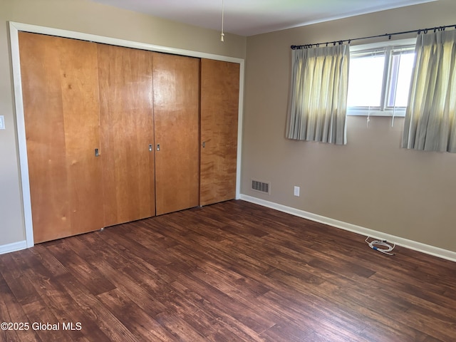 3 State Cir, Gloversville, NY 12078 - unfurnished bedroom with wood finished floors, baseboards, and a closet