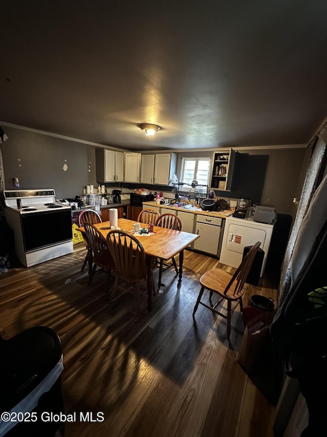 503 N Main St, Gloversville, NY 12078 - dining room with washer / dryer, ornamental molding, and dark wood-style floors