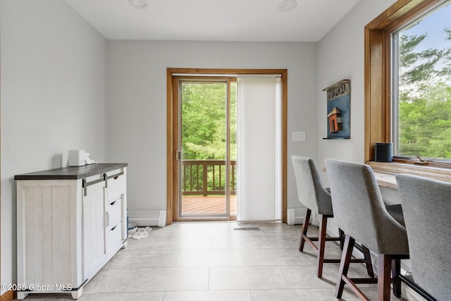 6175 Hawes Rd, Guilderland, NY 12009 - office featuring healthy amount of natural light, light tile patterned floors, and baseboards