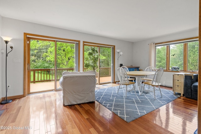6175 Hawes Rd, Guilderland, NY 12009 - dining space with hardwood / wood-style floors and baseboards