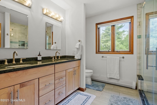 6175 Hawes Rd, Guilderland, NY 12009 - full bath with a stall shower, toilet, double vanity, and baseboards