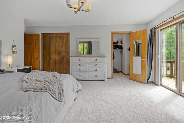 6175 Hawes Rd, Guilderland, NY 12009 - bedroom with access to exterior, multiple windows, light carpet, and baseboards