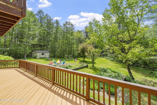 6175 Hawes Rd, Guilderland, NY 12009 - wooden deck with a lawn and a playground