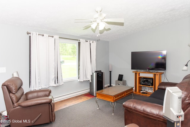 126 Hillside Rd, Duanesburg, NY 12137 - living room with baseboard heating, wood finished floors, a textured ceiling, and a ceiling fan