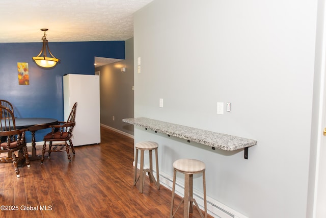 126 Hillside Rd, Duanesburg, NY 12137 - dining space featuring dark wood-style flooring, baseboards, and baseboard heating