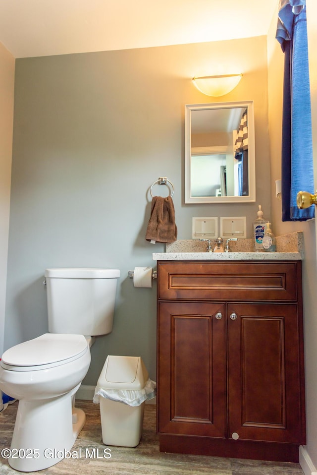 126 Hillside Rd, Duanesburg, NY 12137 - half bath with wood finished floors, vanity, toilet, and baseboards