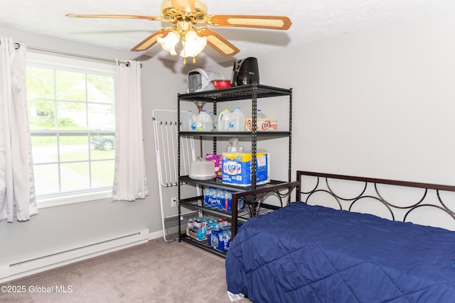 126 Hillside Rd, Duanesburg, NY 12137 - bedroom with a baseboard heating unit, carpet flooring, a ceiling fan, baseboards, and a textured ceiling