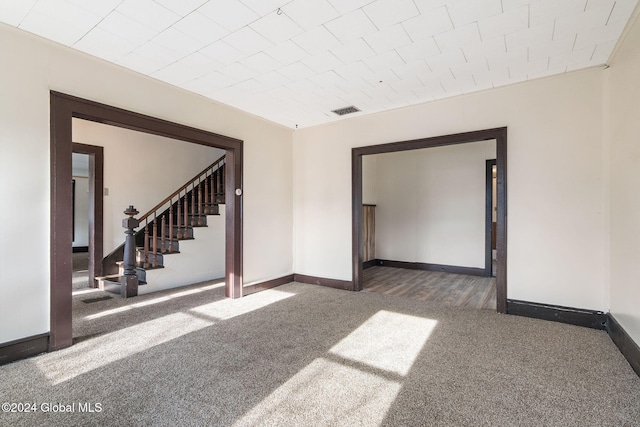 285 Main St, Worcester, NY 12197 - empty room featuring carpet flooring, baseboards, and stairs