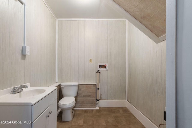 285 Main St, Worcester, NY 12197 - bathroom featuring toilet, vanity, and wood walls