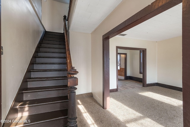 285 Main St, Worcester, NY 12197 - stairway featuring carpet and baseboards