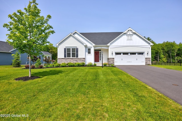 39 Berkeley Way, Wilton, NY 12866 - craftsman-style home featuring stone siding, asphalt driveway, board and batten siding, and a garage