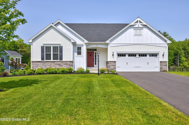 39 Berkeley Way, Wilton, NY 12866 - view of front of house with stone siding, board and batten siding, driveway, and a front yard