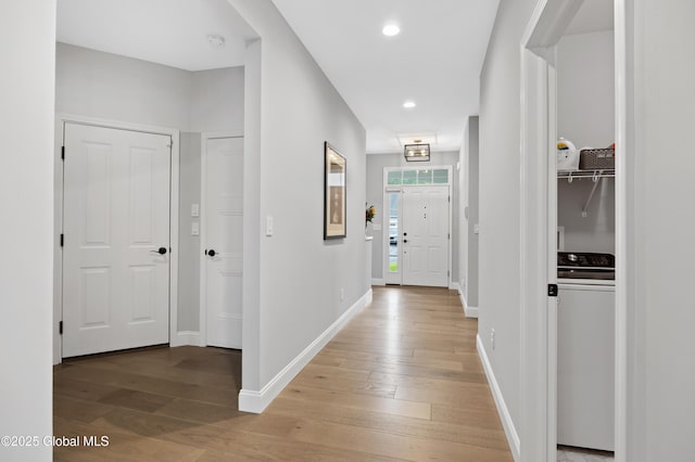 39 Berkeley Way, Wilton, NY 12866 - hall featuring washer / dryer, light wood-style flooring, and recessed lighting