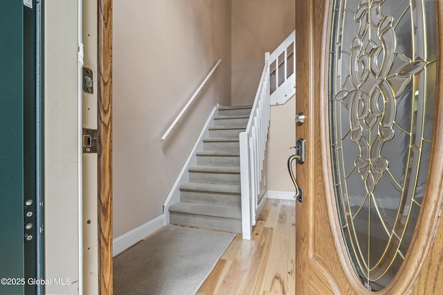 110 Deer Run Dr, Milton, NY 12020 - foyer entrance featuring wood finished floors, stairway, and baseboards