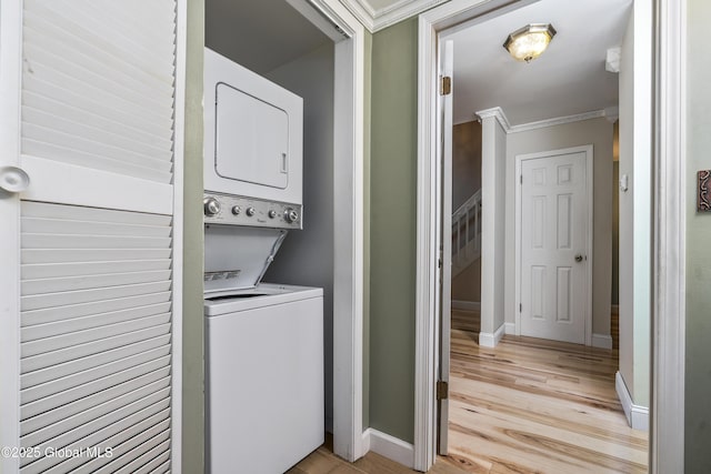 110 Deer Run Dr, Milton, NY 12020 - washroom featuring stacked washer / drying machine, ornamental molding, light wood-style floors, and baseboards