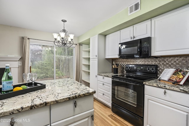110 Deer Run Dr, Milton, NY 12020 - kitchen with black appliances, a chandelier, decorative backsplash, white cabinets, and light wood finished floors