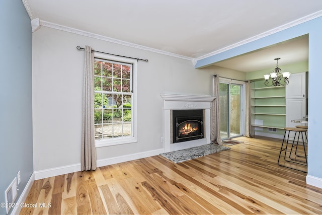110 Deer Run Dr, Milton, NY 12020 - unfurnished living room featuring wood finished floors, a fireplace with flush hearth, plenty of natural light, and ornamental molding