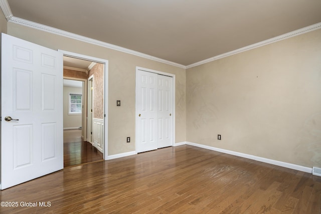 110 Deer Run Dr, Milton, NY 12020 - unfurnished bedroom with wood finished floors, ornamental molding, baseboards, and a closet