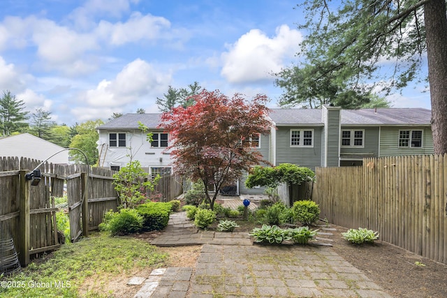 110 Deer Run Dr, Milton, NY 12020 - rear view of house with a fenced backyard and a patio