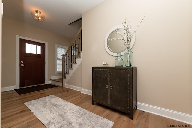 5 Hunter Ct, Milton, NY 12020 - foyer entrance featuring baseboards, wood finished floors, and stairs