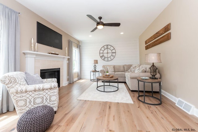 5 Hunter Ct, Milton, NY 12020 - living area with ceiling fan, a tiled fireplace, baseboards, wood finished floors, and recessed lighting
