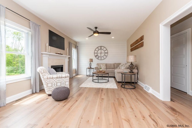 5 Hunter Ct, Milton, NY 12020 - living area featuring wood finished floors, a tiled fireplace, baseboards, a ceiling fan, and recessed lighting