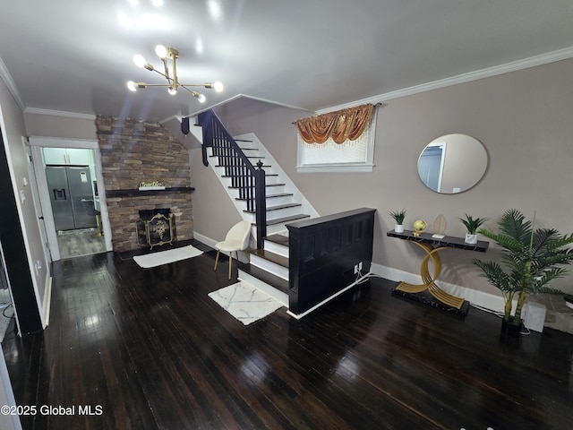 1117 Mcclellan St, Schenectady, NY 12309 - living area with a chandelier, hardwood / wood-style floors, stairway, baseboards, and a stone fireplace