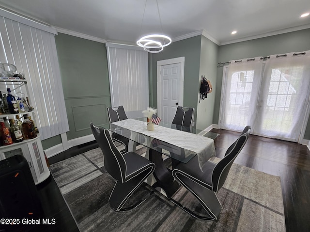 1117 Mcclellan St, Schenectady, NY 12309 - dining area featuring ornamental molding, a chandelier, dark wood-style floors, and baseboards