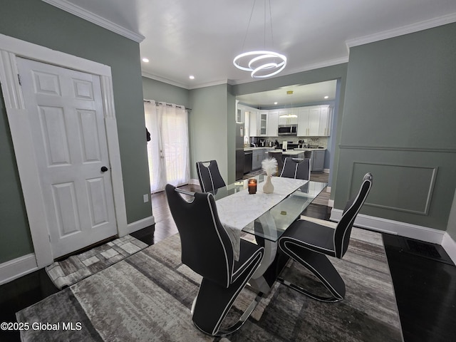 1117 Mcclellan St, Schenectady, NY 12309 - dining space with baseboards, ornamental molding, a chandelier, dark wood-style flooring, and recessed lighting