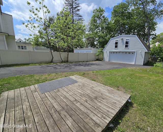 1117 Mcclellan St, Schenectady, NY 12309 - wooden terrace featuring an outdoor structure, a garage, and driveway